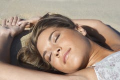 https://thumbs.dreamstime.com/t/peaceful-woman-sunbathing-beach-closeup-young-sandy-31832065.jpg