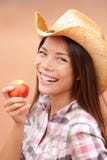 Peach eating cowgirl happy portrait Stock Photo Peach eating cowgirl happy portrait Stock Photo