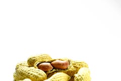 Peanuts isolated on the white background. Close up in blow. stock photos Peanuts isolated on the white background. Close up in blow. stock photos