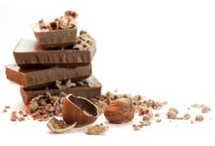 Pedazos del chocolate con las tuercas Imágenes de archivo libres de regalías Pedazos del chocolate con las tuercas Imágenes de archivo libres de regalías