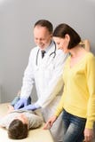 Pediatrician doctor examining child royalty free stock images Pediatrician doctor examining child royalty free stock images