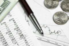 Pen on paper with the price quotes and charts royalty free stock photos Pen on paper with the price quotes and charts royalty free stock photos