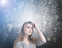 Pensive woman scratching head, questions, toned royalty free stock image Pensive woman scratching head, questions, toned royalty free stock image