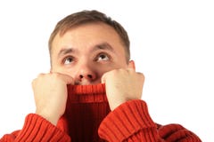 Pensive young man looks upward hiding in sweater royalty free stock photos Pensive young man looks upward hiding in sweater royalty free stock photos