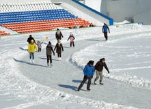 People of all ages skating at the city stadium Royalty Free Stock Images People of all ages skating at the city stadium Royalty Free Stock Images