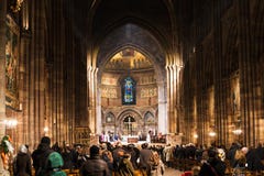 People on church service in Strasbourg Cathedral