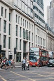 People crossing the road on a pedestrian crossing in front of red bus in City of London, UK. stock images People crossing the road on a pedestrian crossing in front of red bus in City of London, UK. stock images