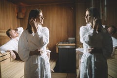 People enjoying sauna health benefits in spa stock photo People enjoying sauna health benefits in spa stock photo