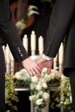 People at funeral consoling each other stock images People at funeral consoling each other stock images