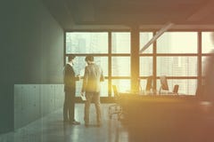 People in gray open space office with closet royalty free stock photo People in gray open space office with closet royalty free stock photo