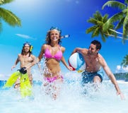 People Playing at a Tropical Beach Enjoyment Concept stock photos People Playing at a Tropical Beach Enjoyment Concept stock photos
