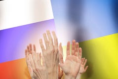 People raising hands on flag Russia and Ukraine background. Conflict concept stock images People raising hands on flag Russia and Ukraine background. Conflict concept stock images