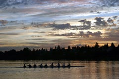 People rowing at sunrise