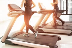 People running in machine treadmill at fitness gym club, royalty free stock photo People running in machine treadmill at fitness gym club, royalty free stock photo