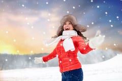 Happy woman in fur hat over winter background stock images Happy woman in fur hat over winter background stock images
