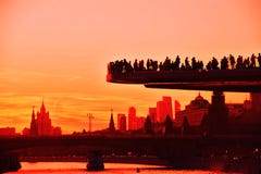 People stand on a glass bridge in Zaryadye park in Moscow. Popular landmark.