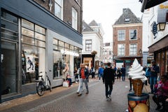People walking on commercial street in historic centre of Utrech. Utrecht, Netherlands - August 4, 2016: People walking on commercial street in historic centre Stock Photos People walking on commercial street in historic centre of Utrech. Utrecht, Netherlands - August 4, 2016: People walking on commercial street in historic centre Stock Photos