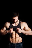 Perfect man shows his six pack abs. Muscular and torso of young male. Hunk with athletic body holding shirt stock images Perfect man shows his six pack abs. Muscular and torso of young male. Hunk with athletic body holding shirt stock images