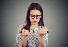 Perfectionist woman looking at fingers nails obsessing about cleanliness royalty free stock photo Perfectionist woman looking at fingers nails obsessing about cleanliness royalty free stock photo