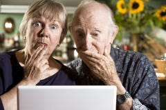 Perplexed Senior Couple with a Laptop Computer Stock Photo Perplexed Senior Couple with a Laptop Computer Stock Photo