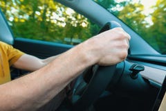 Person driving a new electric vehicle royalty free stock photo Person driving a new electric vehicle royalty free stock photo