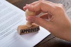 Person Hands Using Stamper On Document stock photos Person Hands Using Stamper On Document stock photos