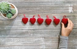 Person holding heart shaped ornaments stock images Person holding heart shaped ornaments stock images