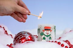 Person Lighting Christmas Candle With Decorations Around It Royalty Free Stock Image Person Lighting Christmas Candle With Decorations Around It Royalty Free Stock Image