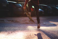 Person in Red Long Sleeved Shirt and Black Skinny Pants Riding a Skateboard Stock Photography Person in Red Long Sleeved Shirt and Black Skinny Pants Riding a Skateboard Stock Photography
