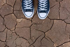 Looking down at my feet on cracked land stock images Looking down at my feet on cracked land stock images