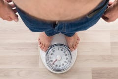 Person Standing On Weighing Scale royalty free stock photography Person Standing On Weighing Scale royalty free stock photography