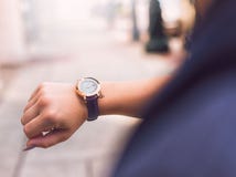 Person Wearing Round Gold Watch With Black Leather Strap Stock Photography Person Wearing Round Gold Watch With Black Leather Strap Stock Photography