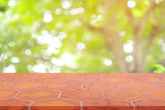 Perspective empty mon brick flooring clay brick blur natural background, can be used mock up for montage products display or royalty free stock photography Perspective empty mon brick flooring clay brick blur natural background, can be used mock up for montage products display or royalty free stock photography