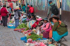 Peruvian street market, old woman selling vegetables and fruits