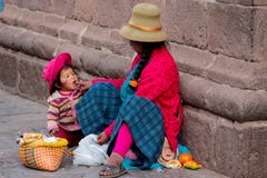 Peruvian woman with a child on the street