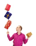 Pessoa do negócio que equilibra três presentes foto de stock Pessoa do negócio que equilibra três presentes foto de stock