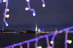 Peter and Paul fortress from Palace bridge decorated at night. Saint Petersburg. Russia Royalty Free Stock Images Peter and Paul fortress from Palace bridge decorated at night. Saint Petersburg. Russia Royalty Free Stock Images