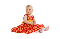 Petit bébé adorable dans la robe rouge se reposant sur le plancher photos stock Petit bébé adorable dans la robe rouge se reposant sur le plancher photos stock