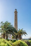 Phare de Faro de Maspalomas dans Gran Canaria devant le ciel bleu image libre de droits Phare de Faro de Maspalomas dans Gran Canaria devant le ciel bleu image libre de droits