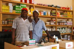 Pharmacists in a small rural pharmacy selling medical products stock photography Pharmacists in a small rural pharmacy selling medical products stock photography