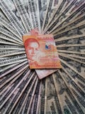 philippine banknote of twenty pesos and background with american dollars bills stock images philippine banknote of twenty pesos and background with american dollars bills stock images