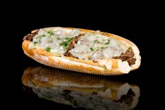 PHILLY CHEESE STEAK With Reflection On Black Background Stock Photos PHILLY CHEESE STEAK With Reflection On Black Background Stock Photos