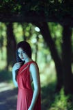 Photo of mystical woman in red dress in fairy forest. Beauty springtime royalty free stock images Photo of mystical woman in red dress in fairy forest. Beauty springtime royalty free stock images