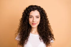 Photo Of Cheerful Positive Cute Sweet Girl Staring At You With Her Hair Curly Isolated Over Beige Pastel Color Stock Images Photo Of Cheerful Positive Cute Sweet Girl Staring At You With Her Hair Curly Isolated Over Beige Pastel Color Stock Images