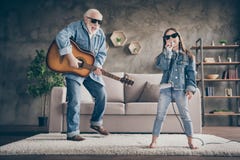 Photo Of Two People Grandpa Play Guitar Small Granddaughter Mic Singing Rejoicing Cool Style Trendy Sun Specs Denim Royalty Free Stock Photos
