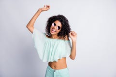 Photo Portrait Of Happy Cheerful Mulatto Girl With Curly Hairstyle Wearing Sunglass Mint Outfit Dancing Isolated On Grey Royalty Free Stock Photos