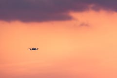 Quadrocopter drone with remote control. Dark silhouette against colorfull sunset. Soft focus. Toned image royalty free stock images Quadrocopter drone with remote control. Dark silhouette against colorfull sunset. Soft focus. Toned image royalty free stock images