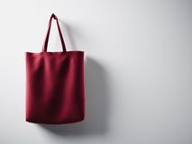 Photo red cotton textile bag hanging left side. Empty white wall background. Highly detailed texture, space for advertising. Horiz vector illustration Photo red cotton textile bag hanging left side. Empty white wall background. Highly detailed texture, space for advertising. Horiz vector illustration