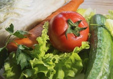 Vegetables - lettuce, tomato, cucumber, cabbage are on the table royalty free stock images Vegetables - lettuce, tomato, cucumber, cabbage are on the table royalty free stock images