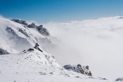 Cliff at the top of the mountain covered with snow stock photography Cliff at the top of the mountain covered with snow stock photography